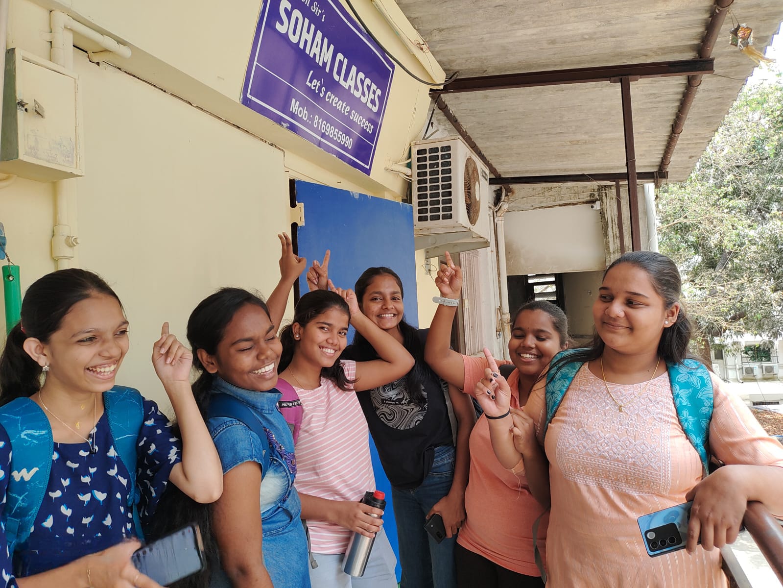 Soham Classes students celebrating outside